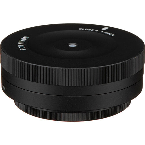 Sigma USB Dock for Nikon F-mount lenses enabling firmware updates, autofocus calibration, and customization of focus speed, focus limiters, and optical stabilization via Sigma Optimization Pro software.