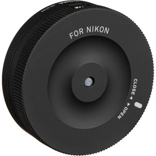 Sigma USB Dock for Nikon F-mount lenses enabling firmware updates, autofocus calibration, and customization of focus speed, focus limiters, and optical stabilization via Sigma Optimization Pro software.