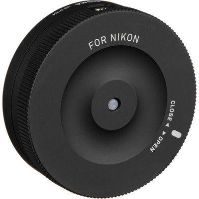 Sigma USB Dock for Nikon F-mount lenses enabling firmware updates, autofocus calibration, and customization of focus speed, focus limiters, and optical stabilization via Sigma Optimization Pro software.