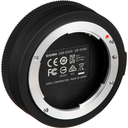 Sigma USB Dock for Nikon F-mount lenses enabling firmware updates, autofocus calibration, and customization of focus speed, focus limiters, and optical stabilization via Sigma Optimization Pro software.