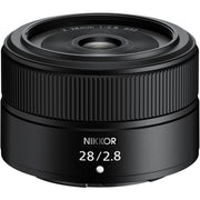 Black camera lens with 'Nikkor' branding on a white background