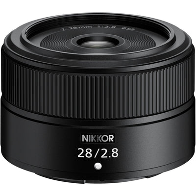 Black camera lens with 'Nikkor' branding on a white background