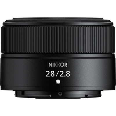 Black Nikon camera lens on a white background