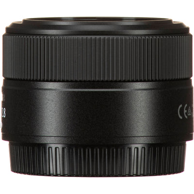 Black camera lens on a white background