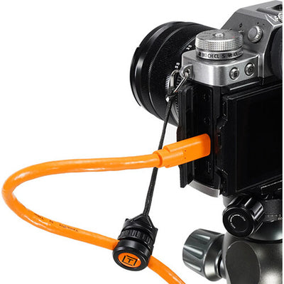 Tether Tools TetherGuard Camera Support attached to camera with tether cable.