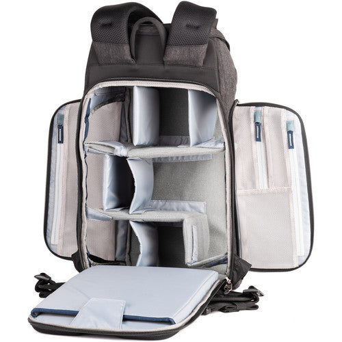 Think Tank Urban Access 15 camera backpack — black pack with side-loading panels, rear entry flap, and front tripod strap.