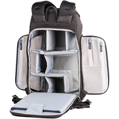 Think Tank Urban Access 15 camera backpack — black pack with side-loading panels, rear entry flap, and front tripod strap.