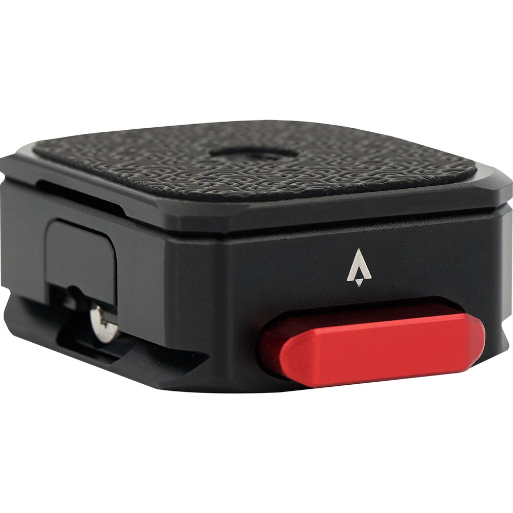 Black camera accessory with a red button on a white background
