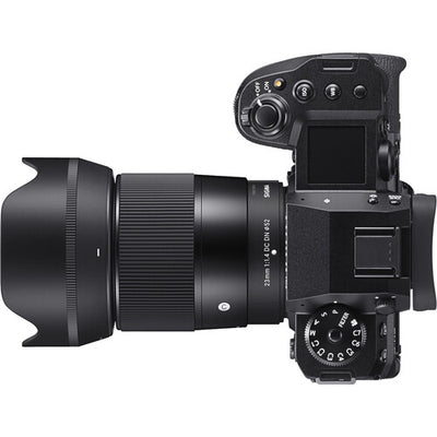 Sigma 23mm f/1.4 DC DN Contemporary wide-angle prime lens for APS-C mirrorless cameras featuring bright f/1.4 aperture, advanced optics with SLD and aspherical elements, compact lightweight design, and quiet high-speed autofocus.