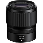 Black Nikon camera lens on a white background