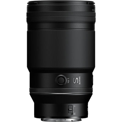 Black camera lens on a white background