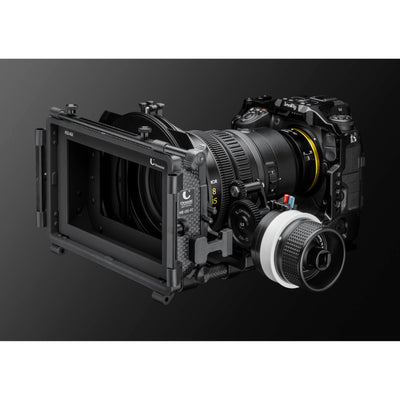 Camera lens and mechanical components on a dark background