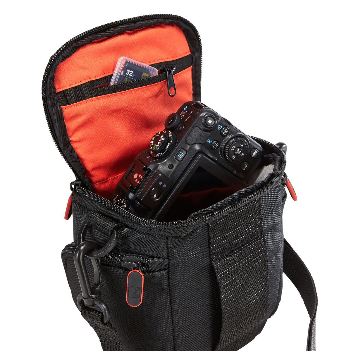 Camera in a black bag with an open pocket showing memory cards on a white background