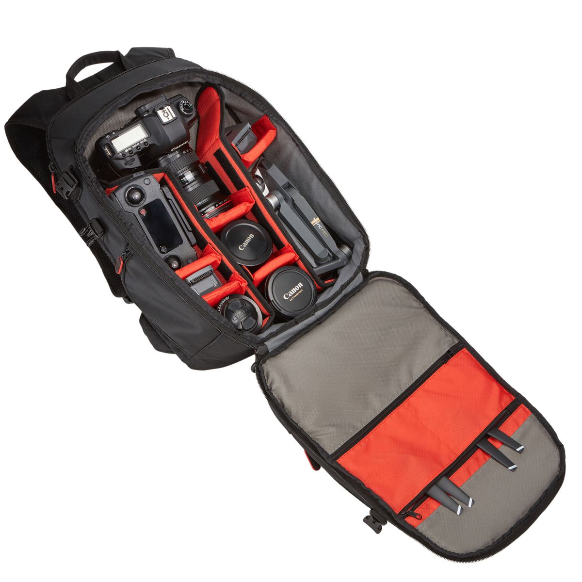Camera backpack with compartments for camera equipment on a white background
