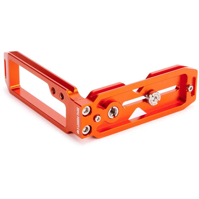 3-Legged-Thing QR11 FBC-2 universal L-bracket in orange, Arca-Swiss compatible with adjustable vertical and horizontal mounting via quick-release clamp.