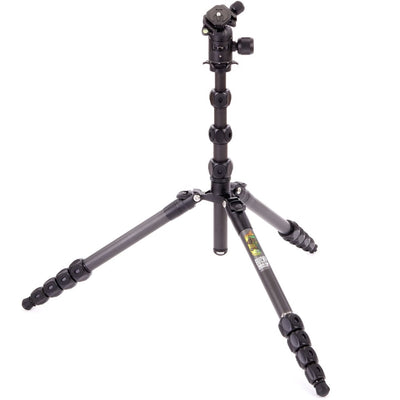 Black camera tripod on a white background