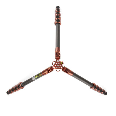 Metallic tripod stand with decorative elements on a white background