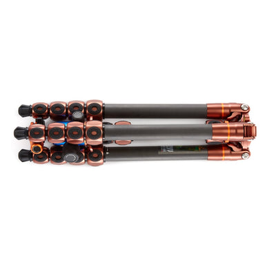 Camera tripod with black and copper accents on a white background