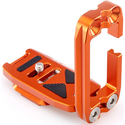 Orange metal clamp on a white background