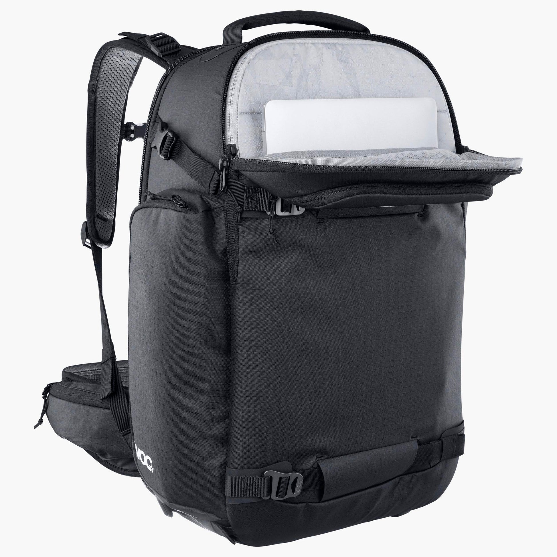 Black backpack with open compartment showing a white tablet