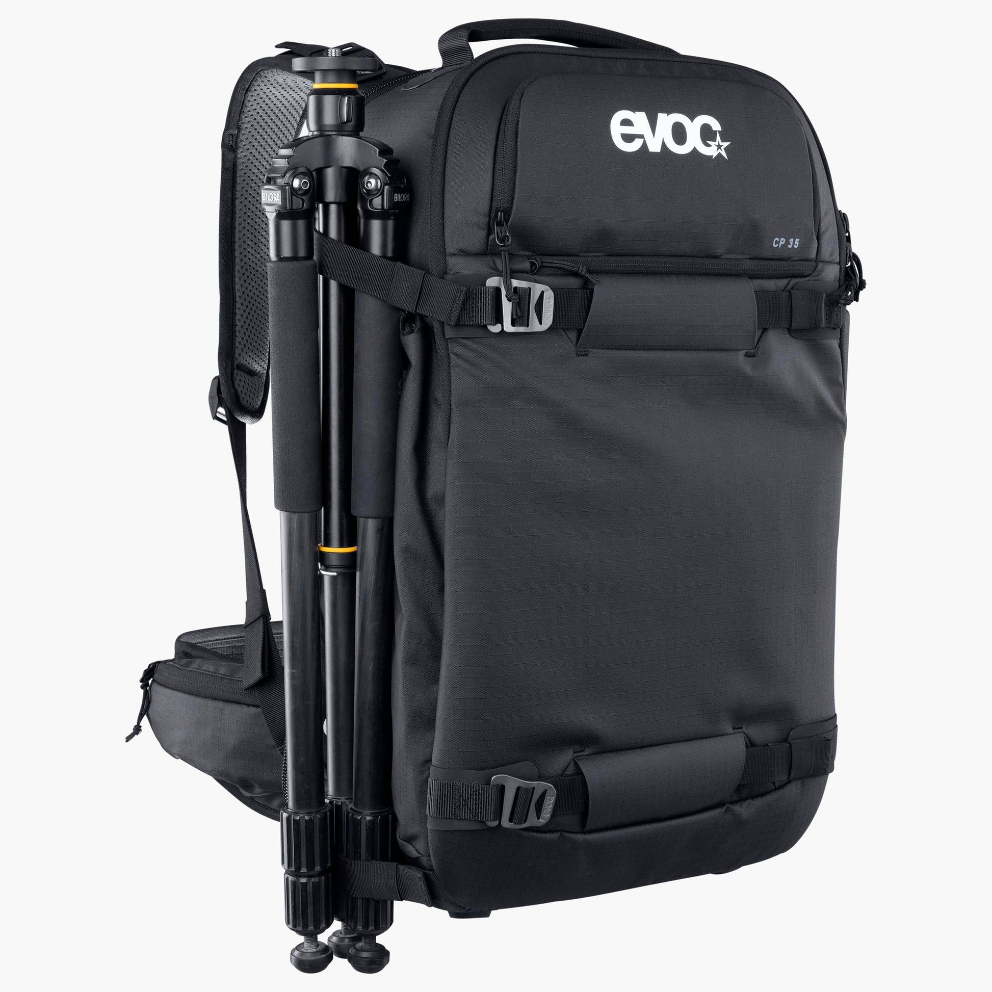 Black backpack with a camera tripod attached on a white background, featuring the Evoc brand.