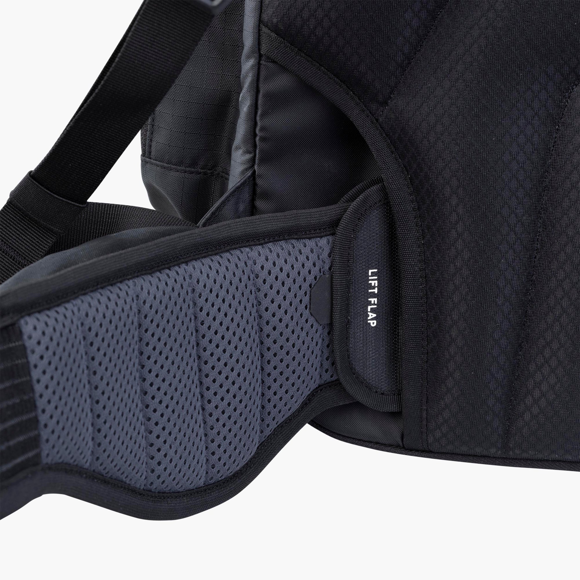 Close-up of a black backpack with a lift flap on a white background