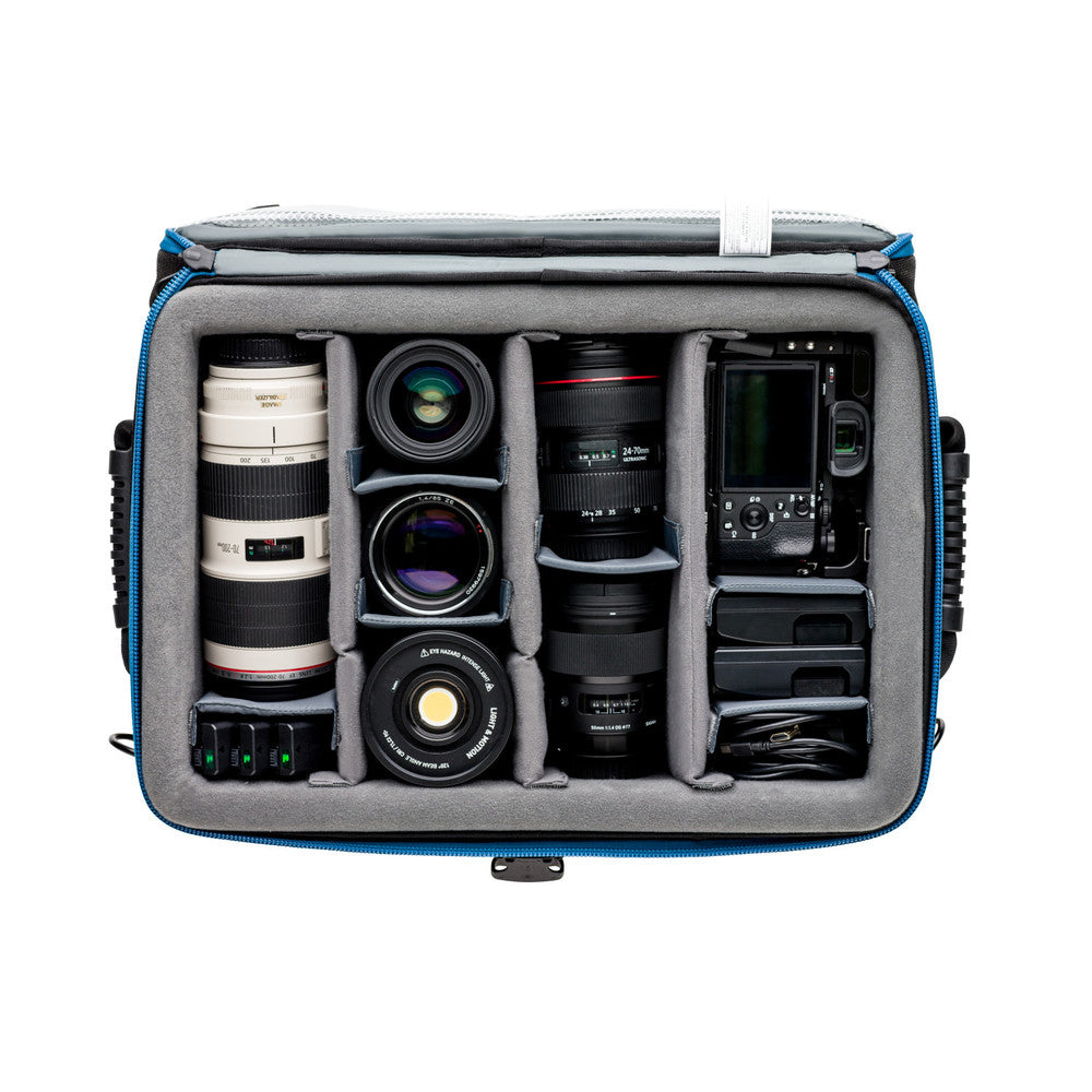 Camera bag with compartments for camera equipment on a white background