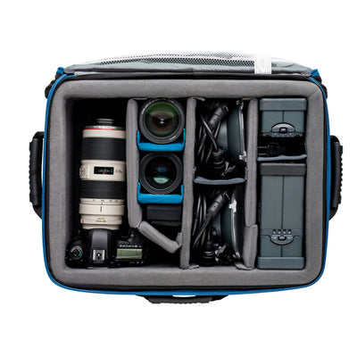 Camera bag with compartments containing camera equipment on a white background