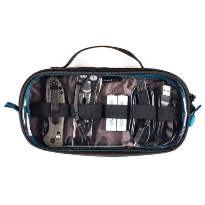 Black travel pouch with various tools and cables on a white background