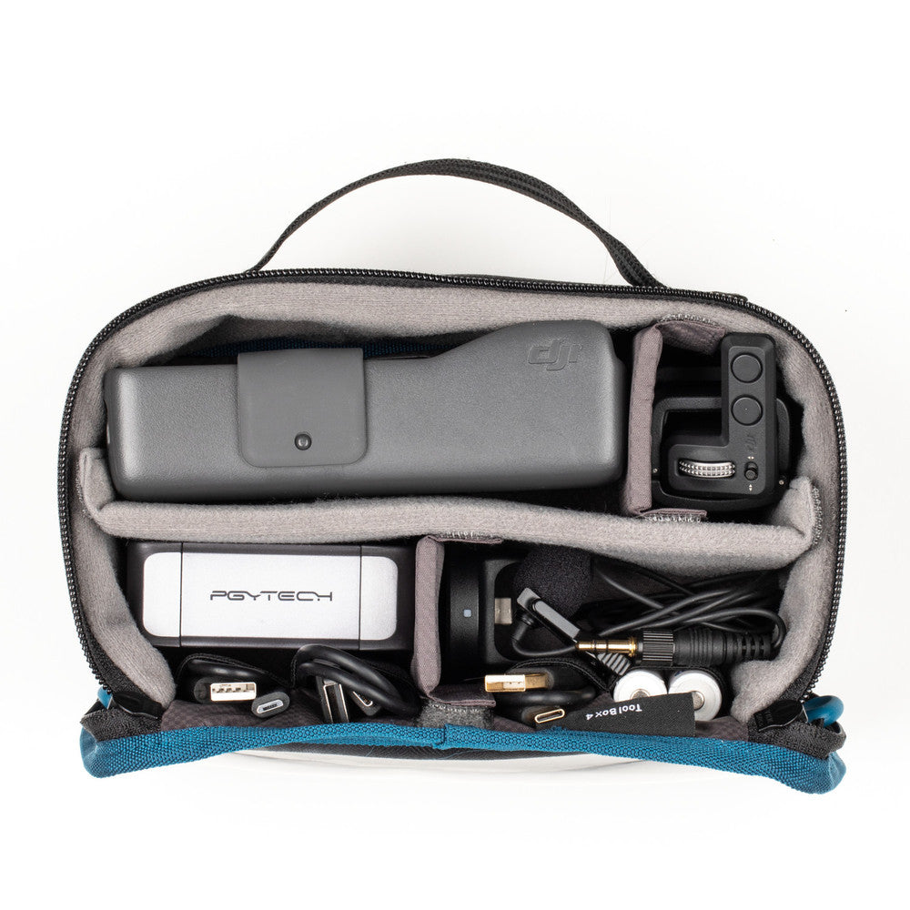 Pouch containing electronic devices and accessories on a white background