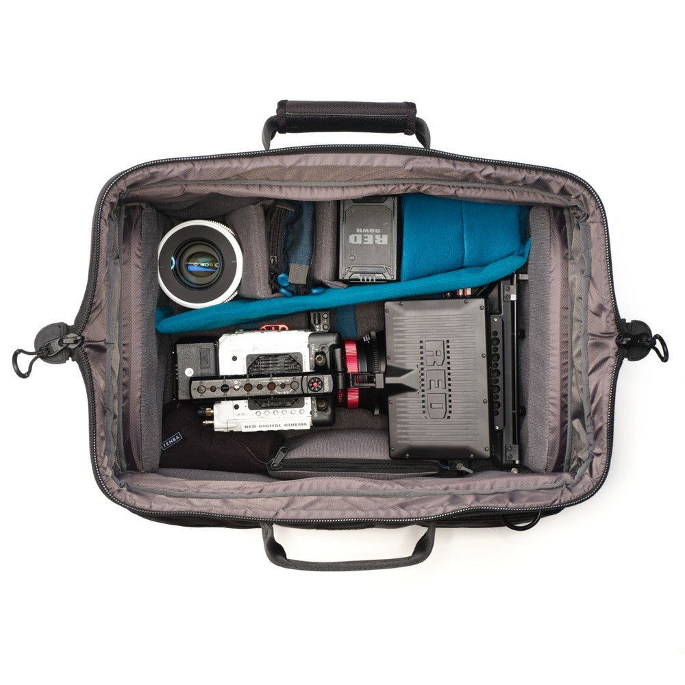 Open camera bag with photography equipment on a white background