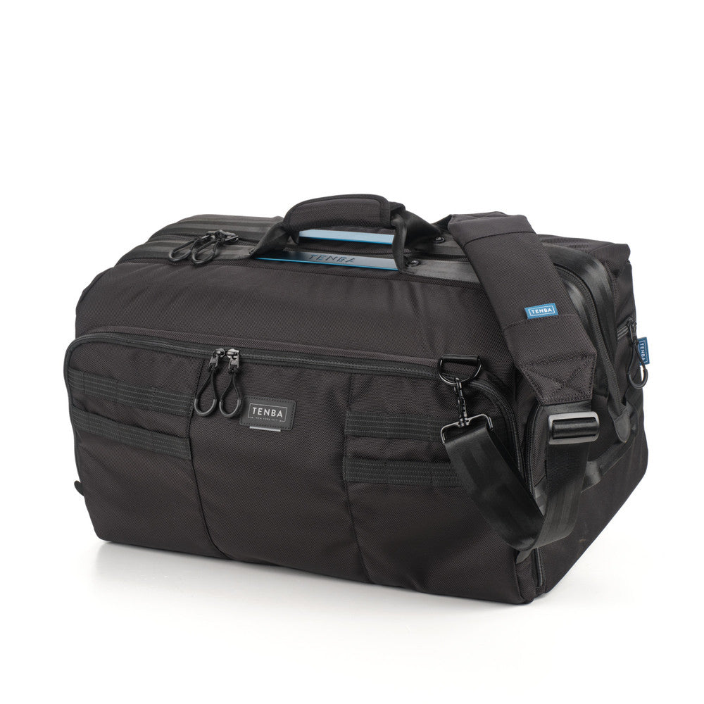 Black duffel bag with multiple compartments and straps on a white background