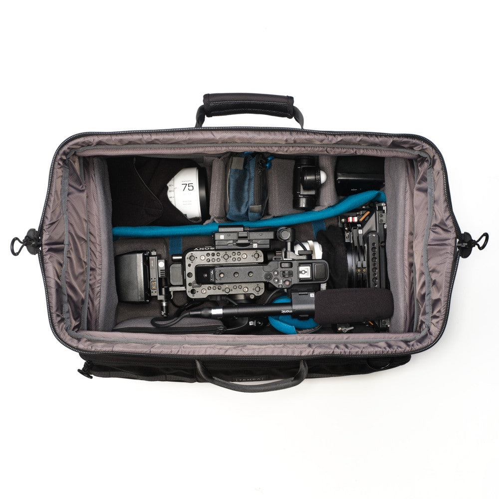 Camera equipment inside a gray carrying case on a white background