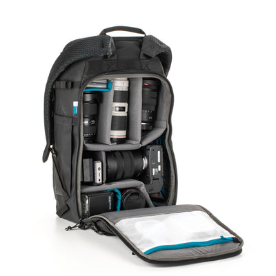 Camera backpack with compartments for camera equipment on a white background