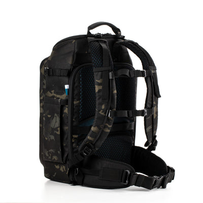 Black and camouflage-patterned backpack on a white background