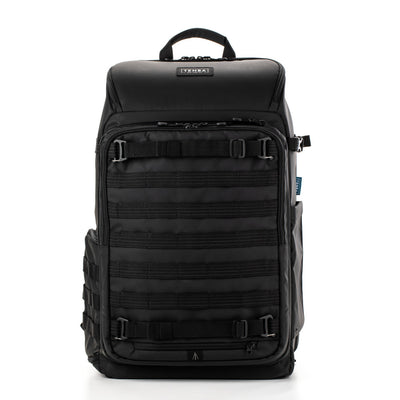 Black backpack with multiple straps on a white background