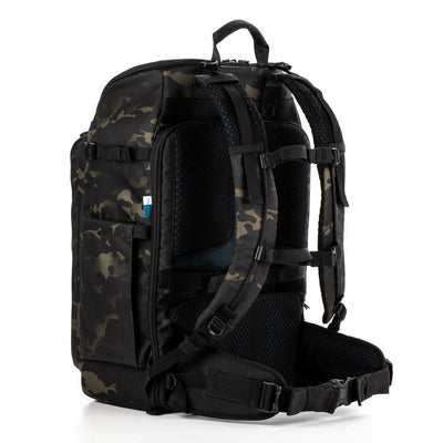 Camouflage backpack with black straps on a white background