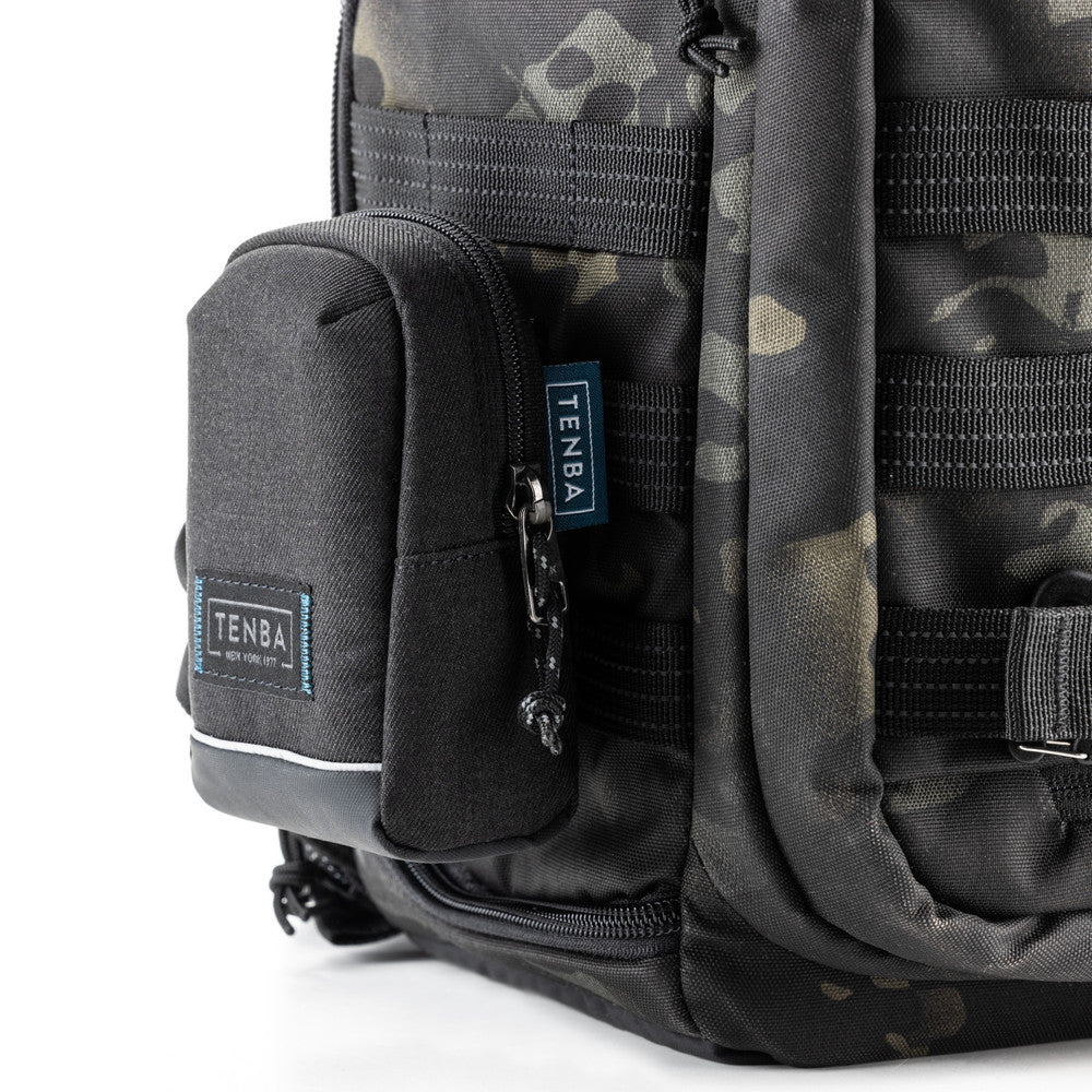 Camouflage backpack with multiple pockets and Tenba branding on a white background