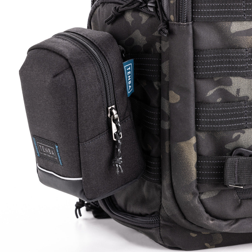 Black tactical backpack with multiple compartments and a visible brand logo on a white background