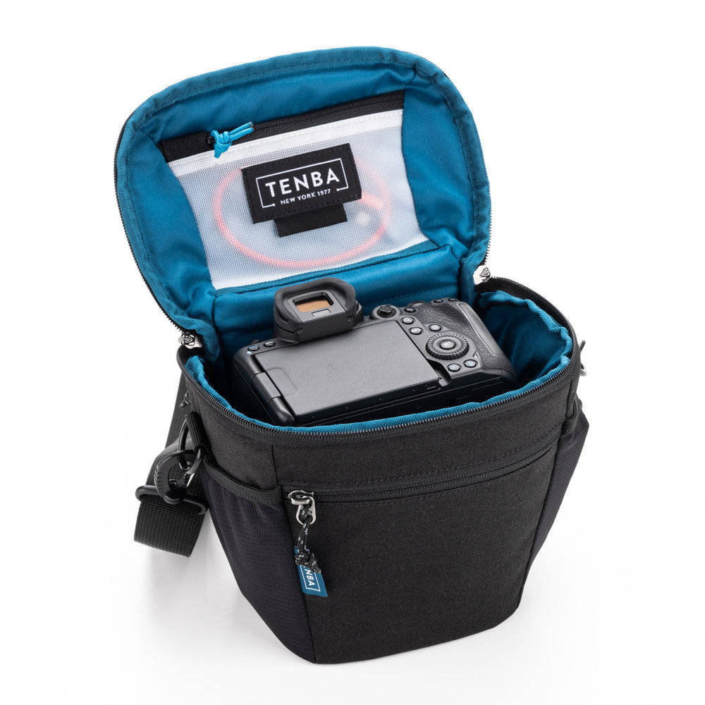 Camera bag with a camera inside, featuring the Tenba brand on a white background