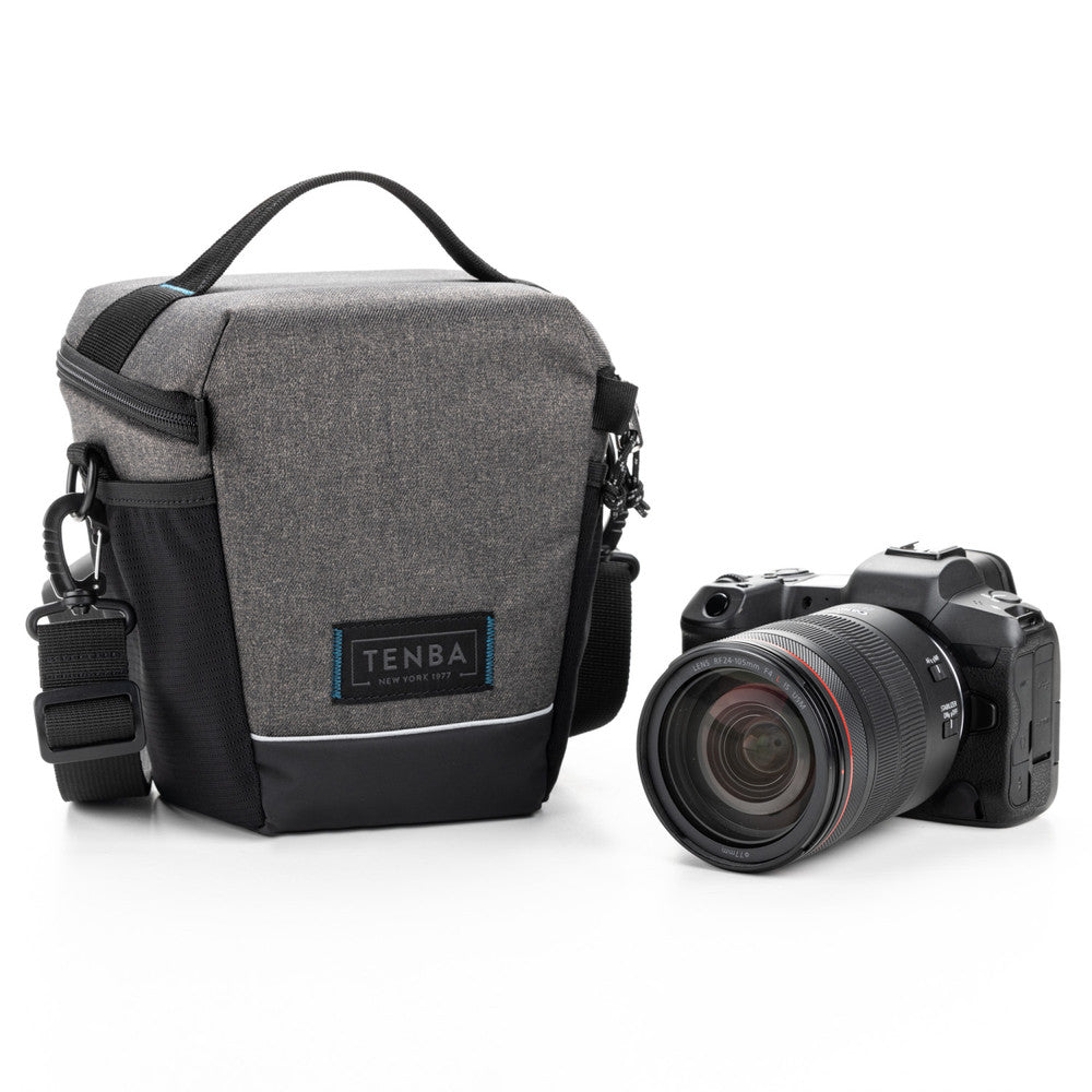 Gray camera bag with black accents and a camera on a white background