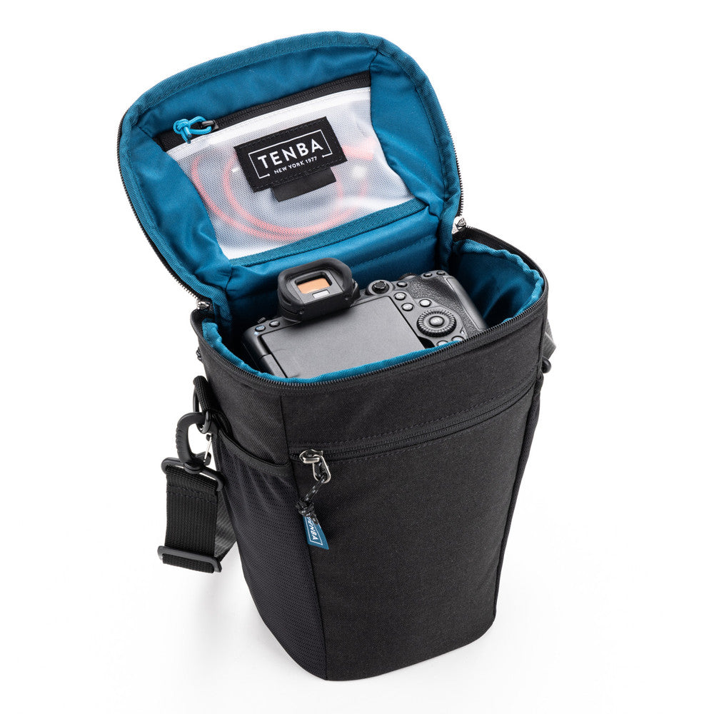 Camera bag with a camera inside, featuring Tenba brand on a white background