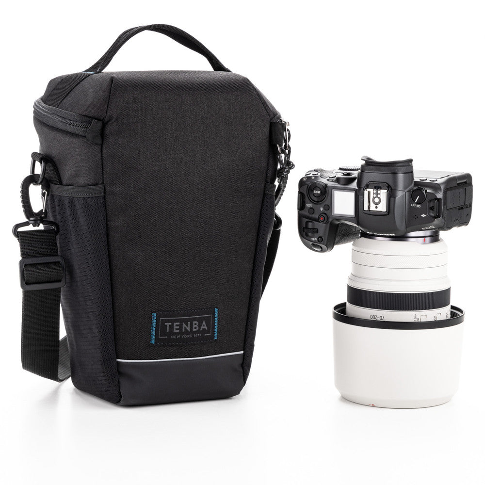 Black camera bag with a camera and lens on a white background