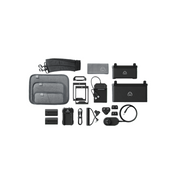 Collection of electronic devices and accessories on a green background