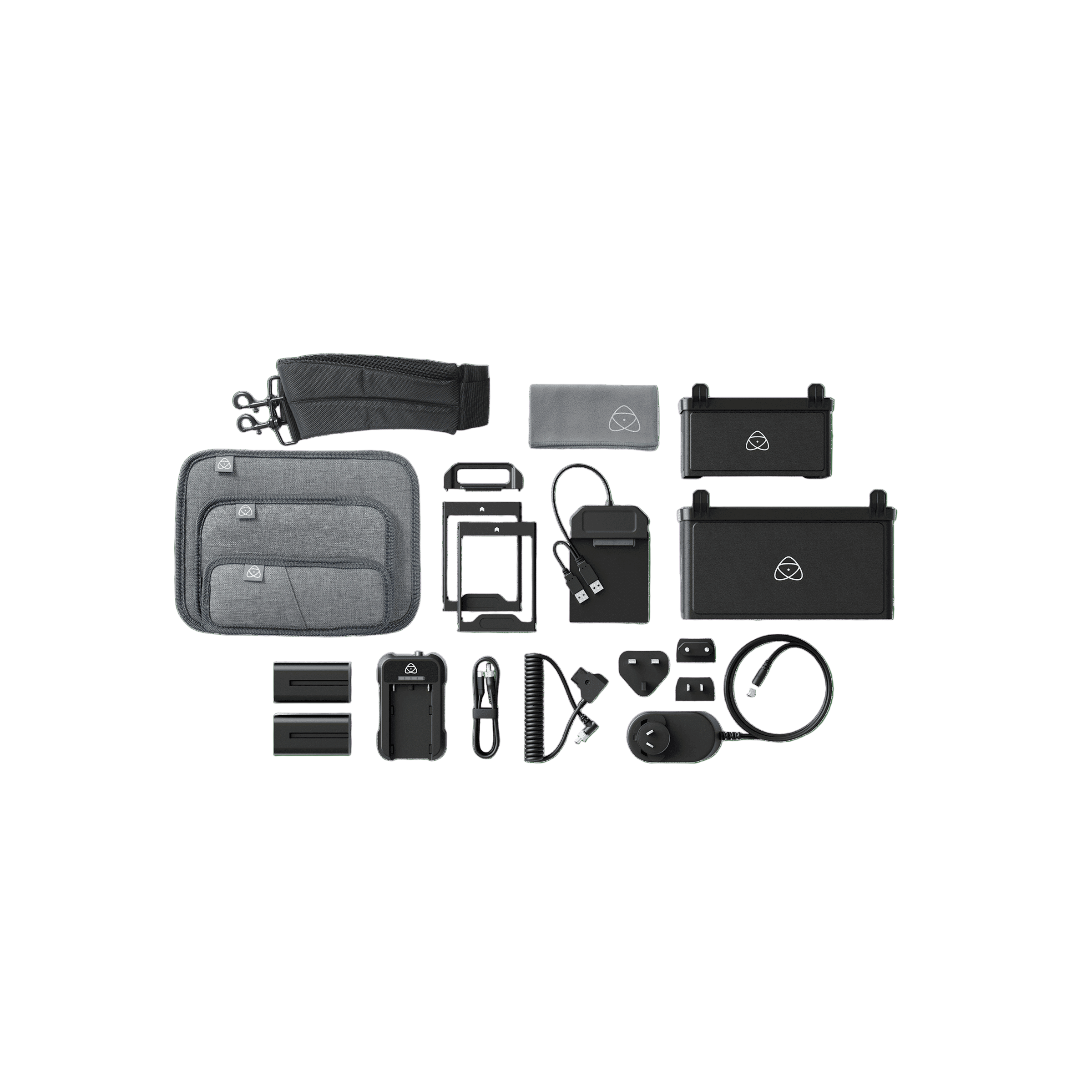 Collection of electronic devices and accessories on a green background