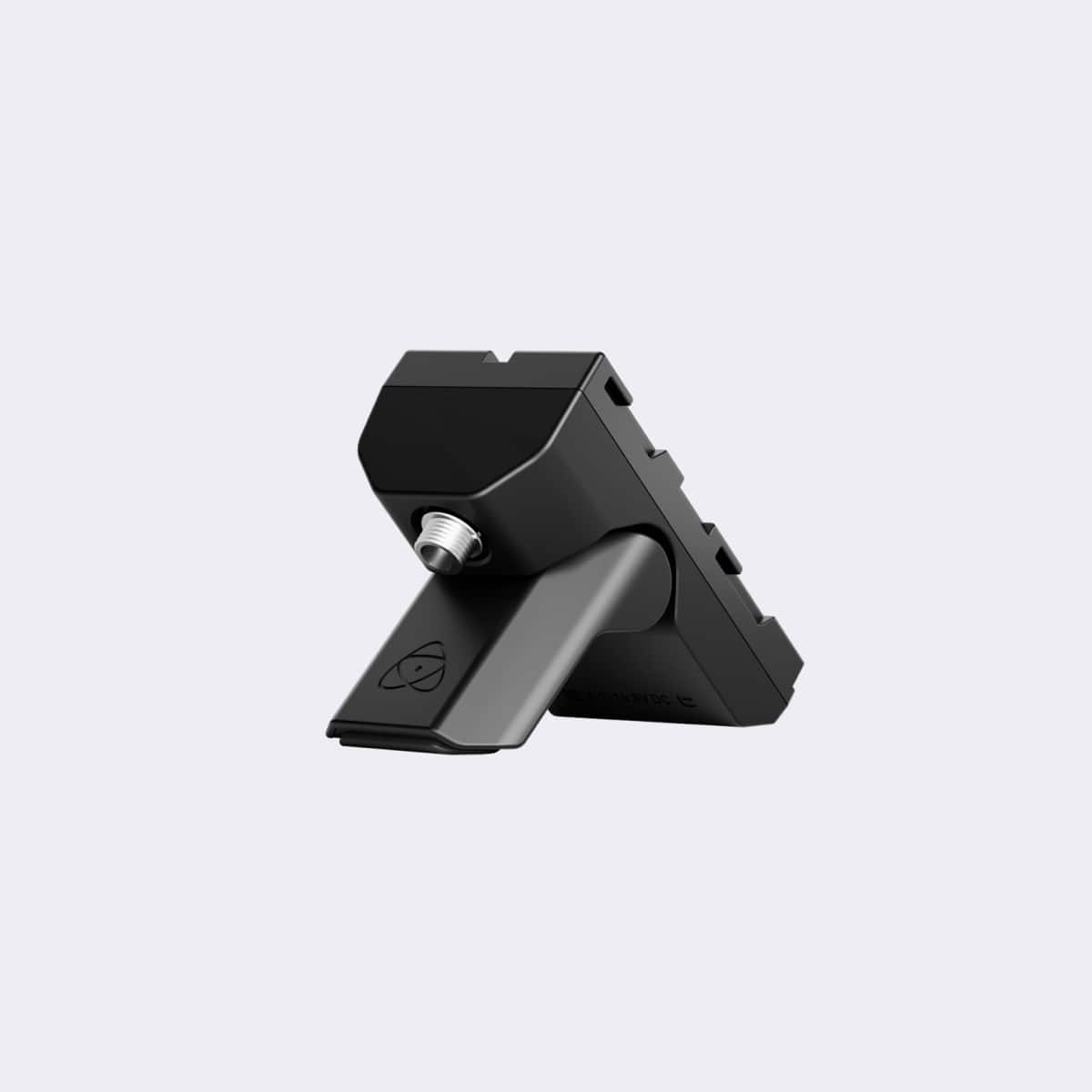 Black camera lens cap on a light gray background