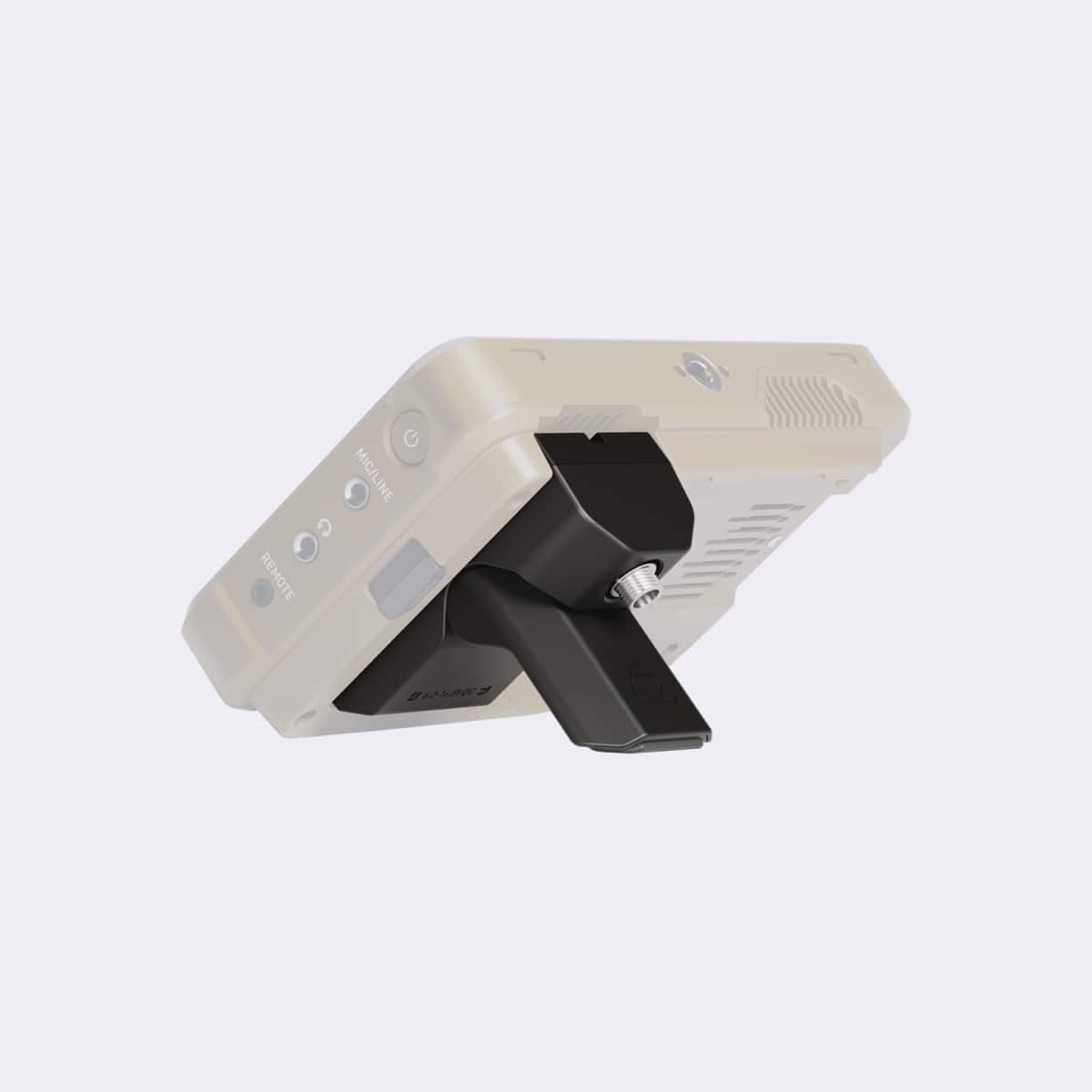 Beige electronic device with a black component on a light gray background