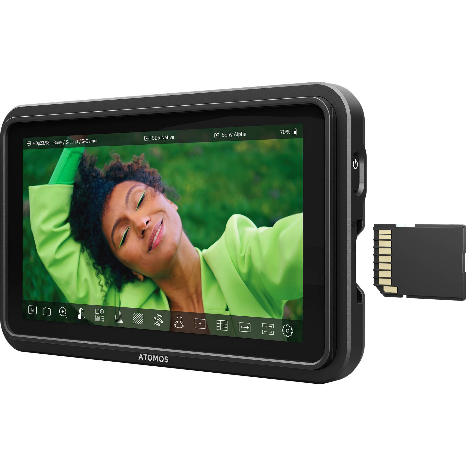 ATOMOS display with a person in a green shirt on the screen, accompanied by an SD card.