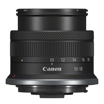 Canon camera lens with focus scale on a white background