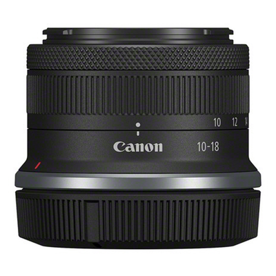 Canon camera lens with focus scale on a white background